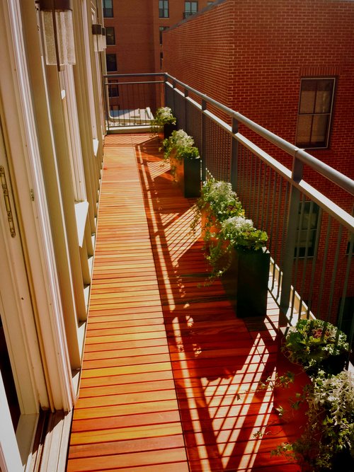 Narrow balcony planters in sunlight